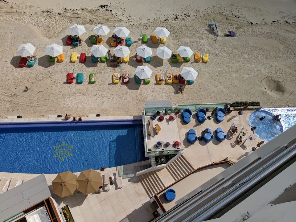 Ariel view of pools and beanbag lounges on beach