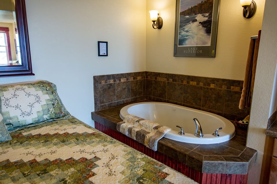 Queen Bed and Spa Tub
There is nothing more important that a good night's sleep. Our plush queen bed with ample pillows and warm bedding provides this for you.