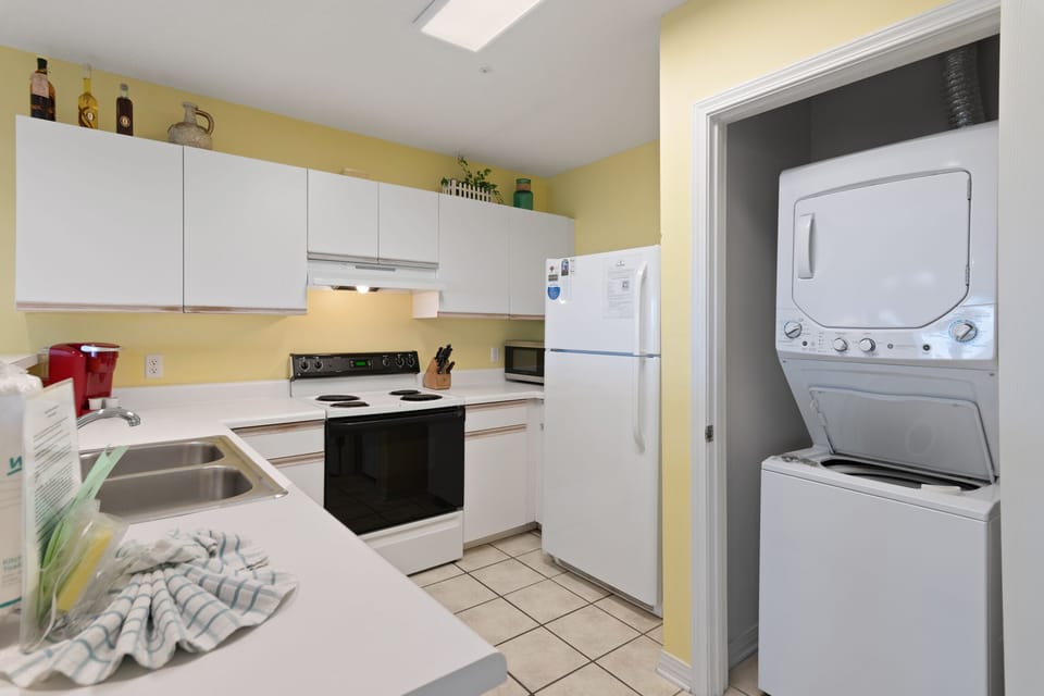 A stacked washer and dryer keeps packing light.