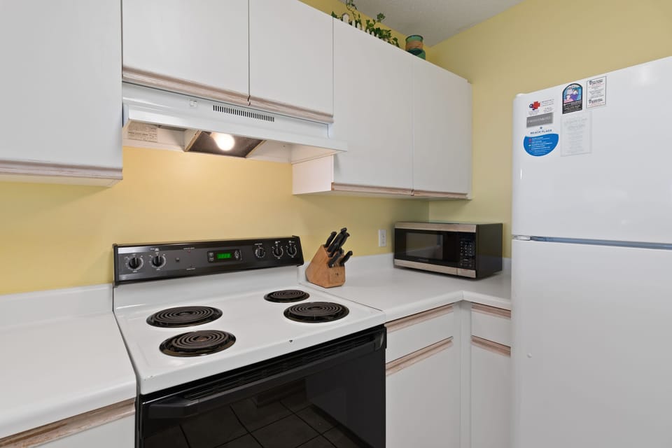 Full-size appliances and everything you need to cook in.