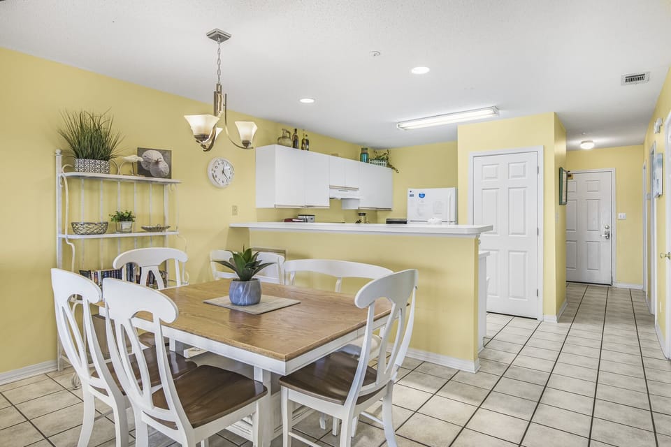 Plenty of space for meals, game nights, or reconnecting after a day in the sun — right off the kitchen.