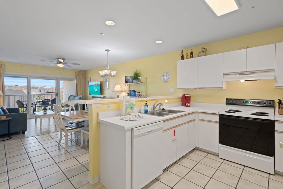 The kitchen opens to the dining area for easy entertaining.