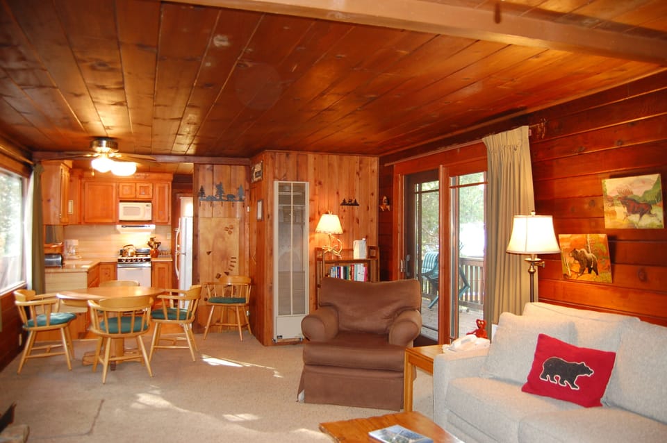 Living room, reverse angle with dining area and kitchen in background