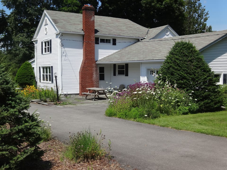 back of farm house with patio for BBQ