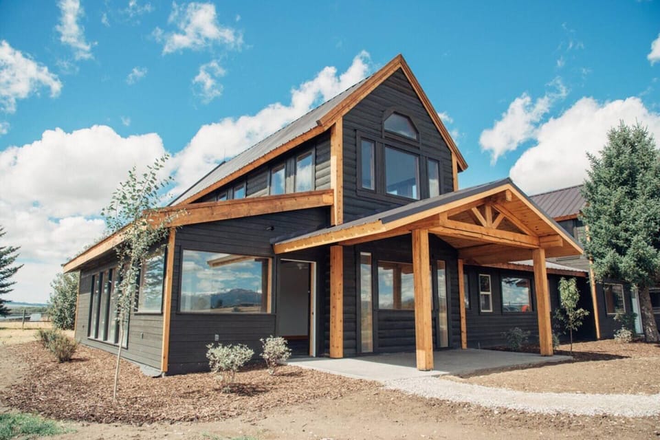 The spacious unit features beautiful farmhouse-style architecture.