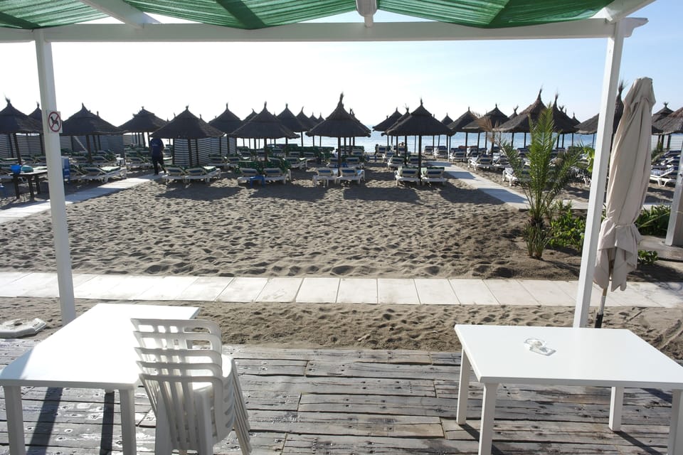 One of the many beach bars near the apartment just setting up for the day.