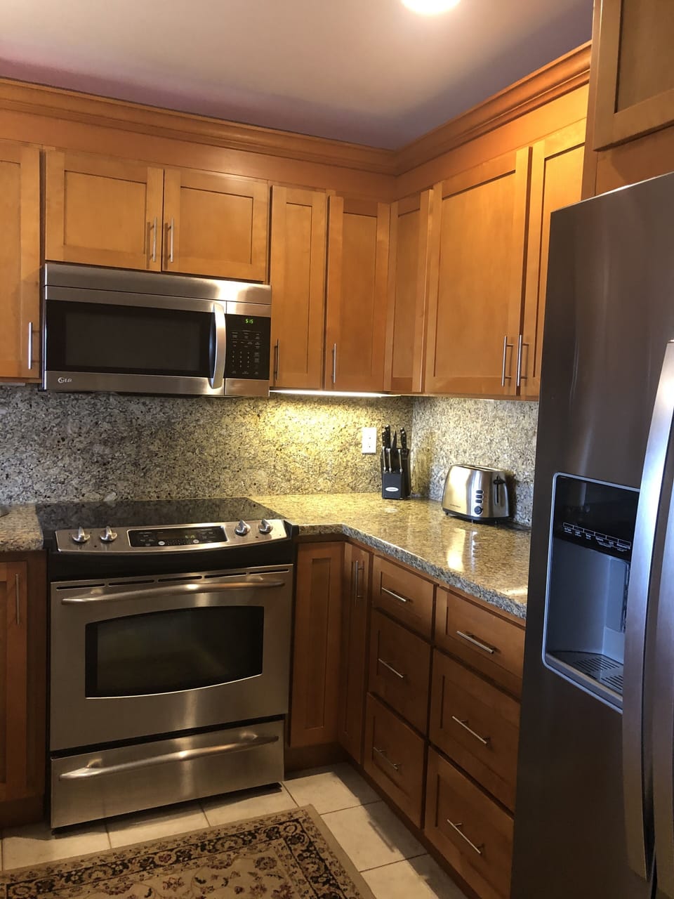 Kitchen with dispenser on the refridgerator door for water