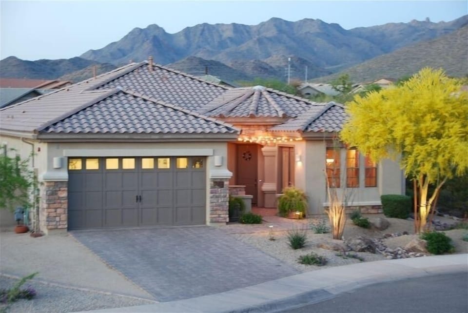 Resort Style Home with mountain background and courtyard / fireplace entry 