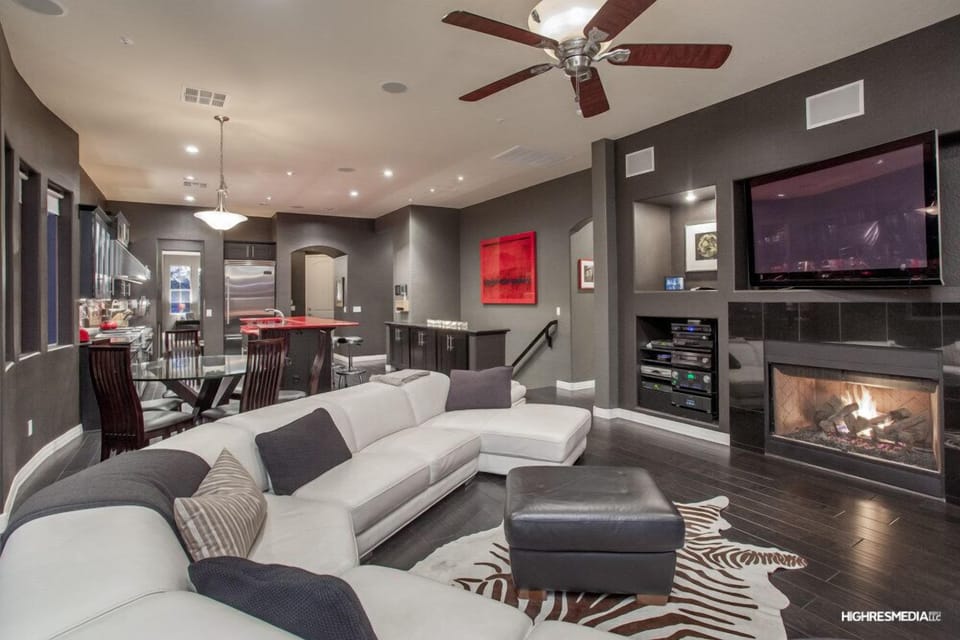 Family room with 80" flatscreen, fireplace, surround sound