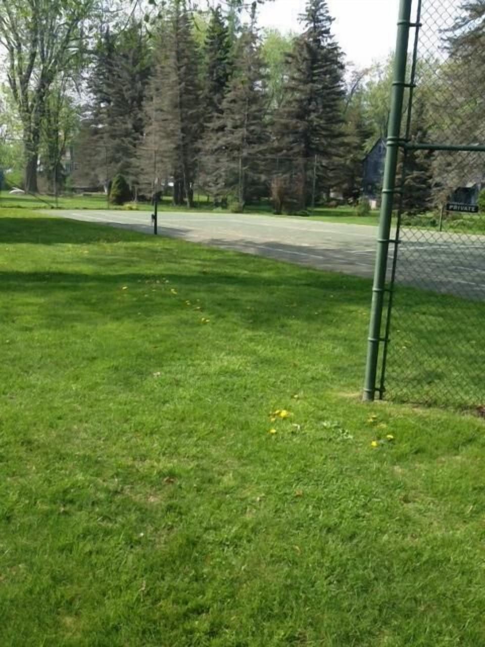 Tennis Court in the front yard.
