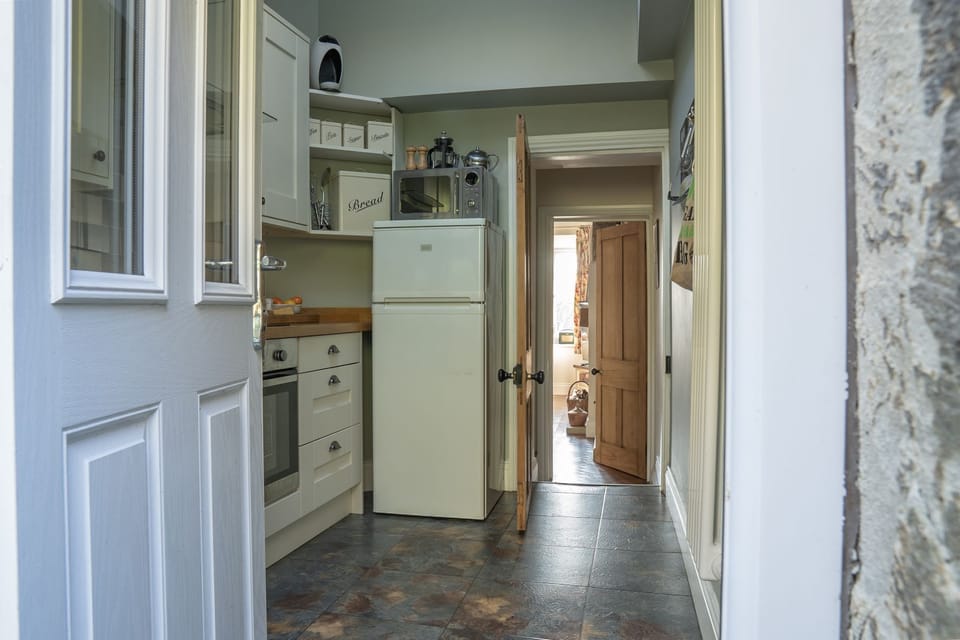From the back door through the kitchen to the hallway & into the living room