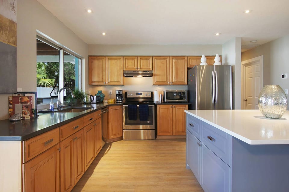Kitchen with granite countertops and new stainless steel appliances