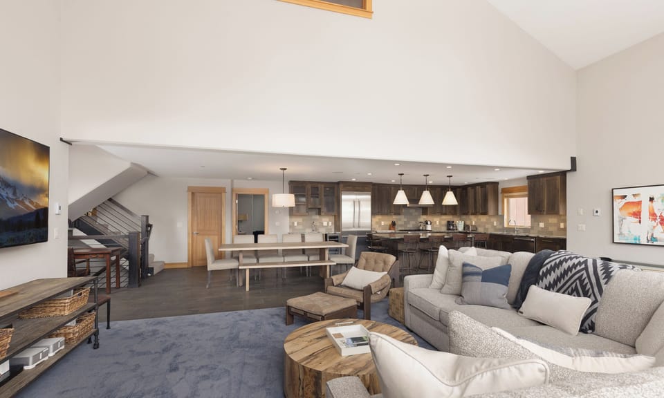 Sink into plush sofas in your open-concept living space, where the gourmet kitchen and cozy fireplace create the perfect mountain retreat.
