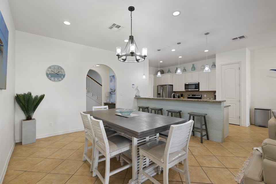 Coastal-inspired dining space connected to the open kitchen layout