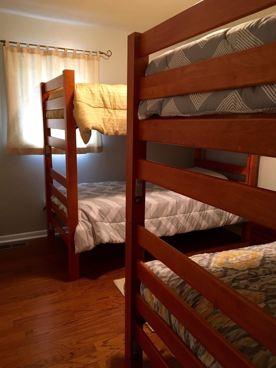 This bedroom with two sets of extra-long twin bunks sleeps four.
