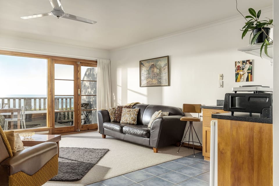 Living area with sea and mountain views
