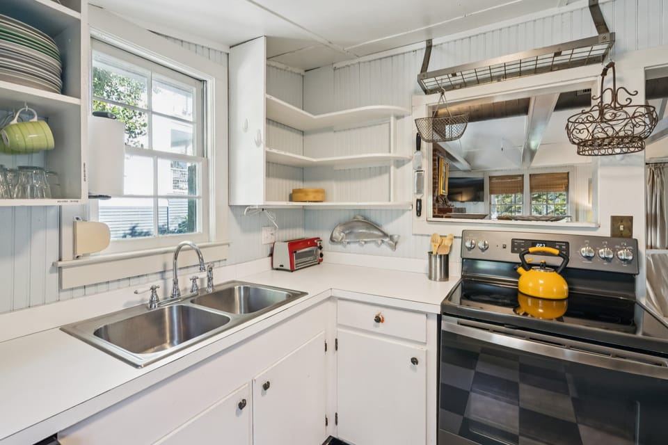 Compact convenience. Preparing beach snacks and morning coffee is a breeze in this tidy space.