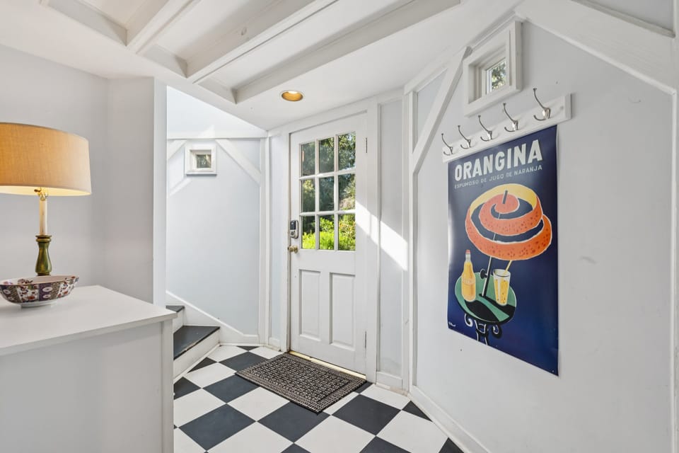 You enter the home on the ground floor, right off the driveway.