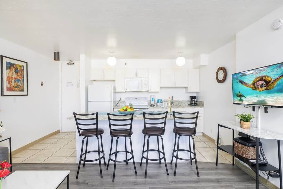 Dining area with 4 cozy bar stools!