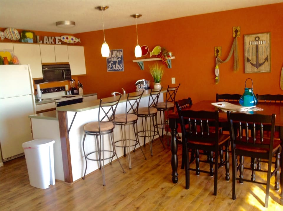 Kitchen with bar seating and dining table for six
