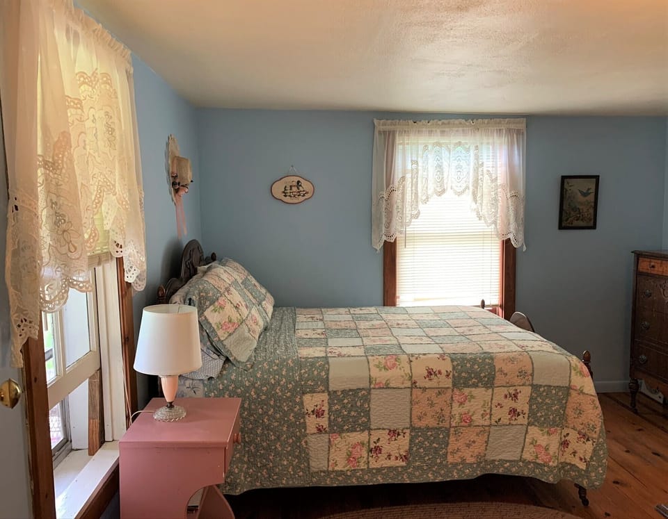 Blue Bedroom downstairs features a full bed and antique furniture