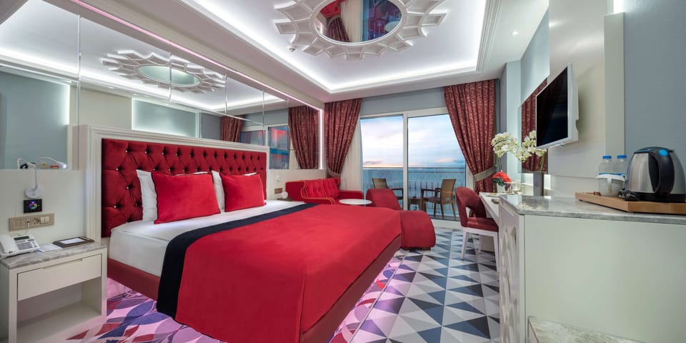 Honeymoon Room, Sea View | Free minibar items, in-room safe, desk, blackout drapes