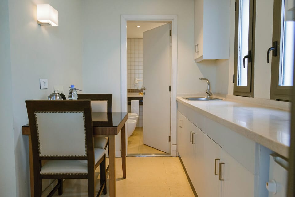 Business Suite, Kitchenette | Minibar, in-room safe, desk, soundproofing
