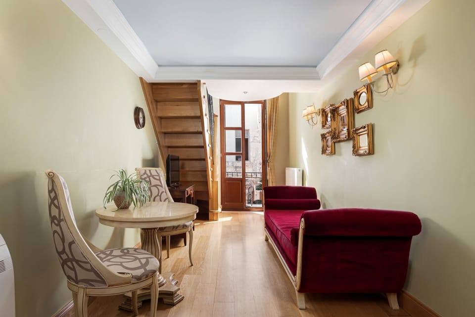 Deluxe Suite, Balcony | Egyptian cotton sheets, down comforters, memory foam beds, in-room safe