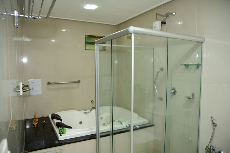 Luxury Room, Jetted Tub | Bathroom | Shower, hair dryer, towels