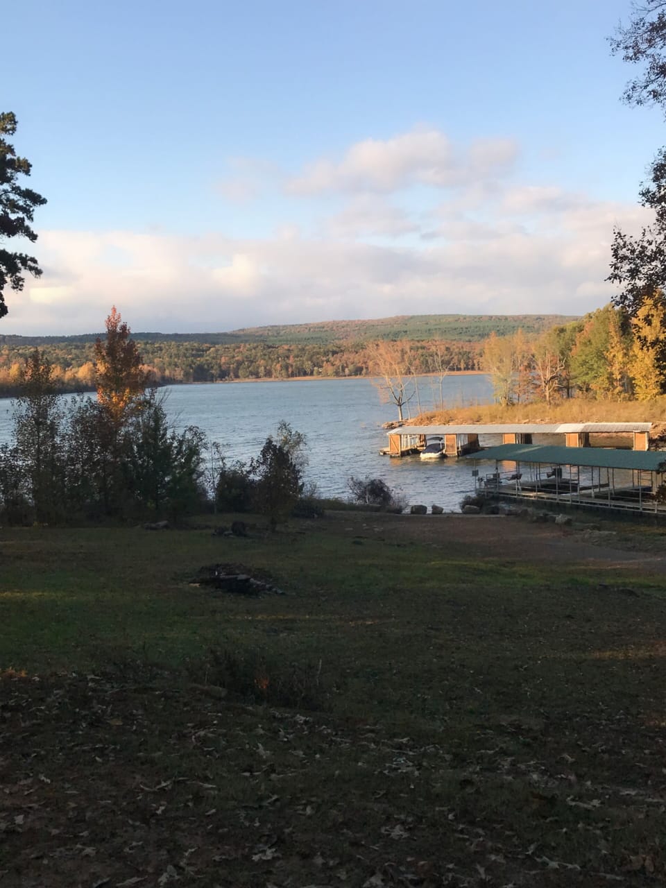 View from the driveway with boat dock to the right.
