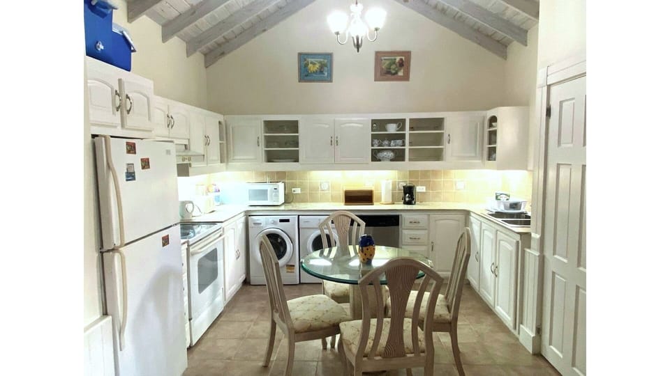 kitchen with laundry and eating area (3rd bathroom/powder room to the right)