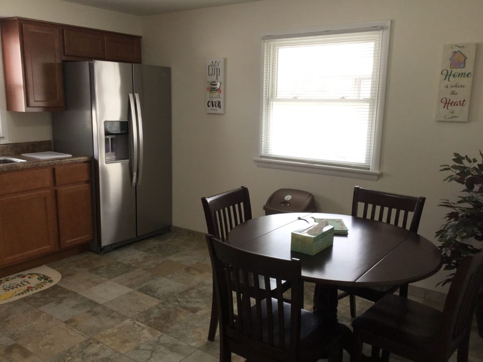 Roomy and well-lit kitchen to enjoy home cooked meals or delivered pizza! 