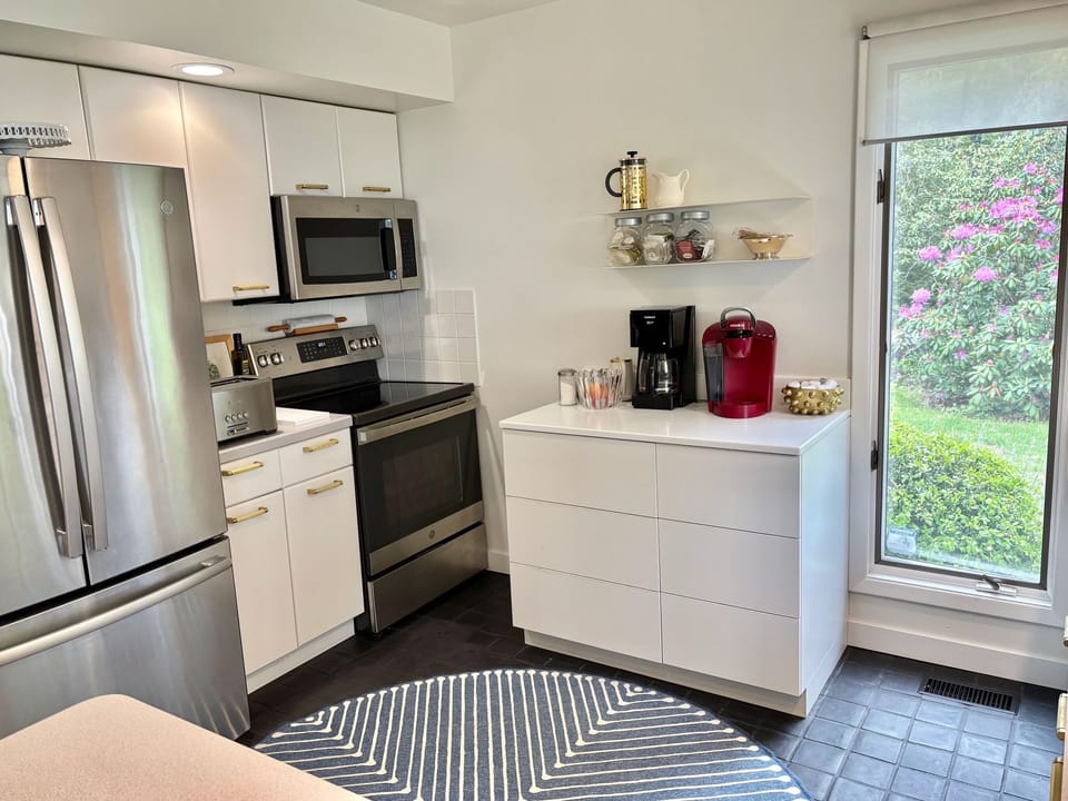 Kitchen with Coffee Counter, new stove and dishwasher.