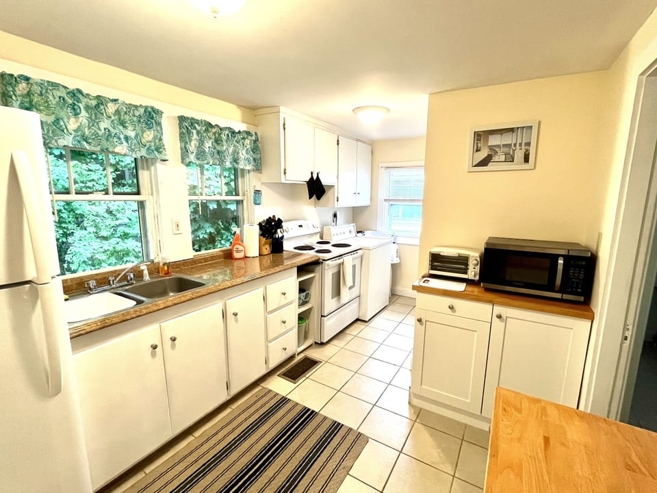 Kitchen with ceramic tile and washing machine! 