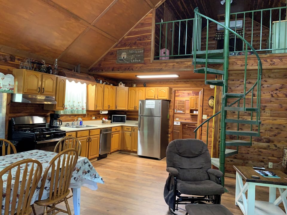 Nice shot of loft with spiral staircase.
