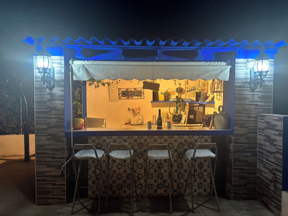 Private pool bar by night 