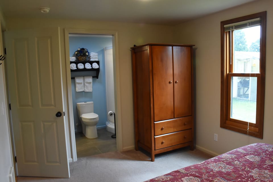 Armoire stores extra sheets and blankets plus room to hang your clothes