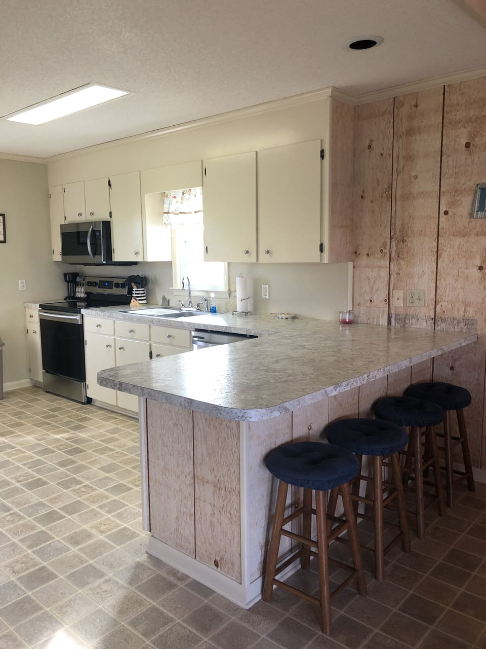 Newly remodeled kitchen.  New countertops,  stove, microwave and dishwasher.