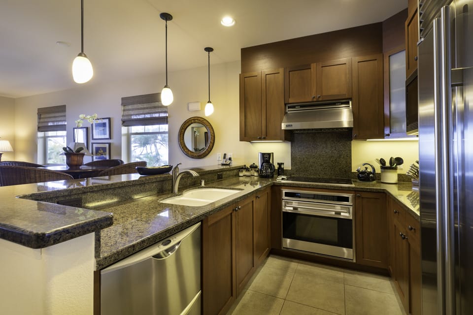 In the center of the action, the kitchen is part of an open great room with the dining area and living room; views take your eye straight outdoors to the magnificent ocean beyond.