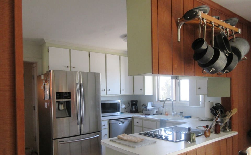 Kitchen with beautiful new flooring &  stainless steel appliances with wet bar.
