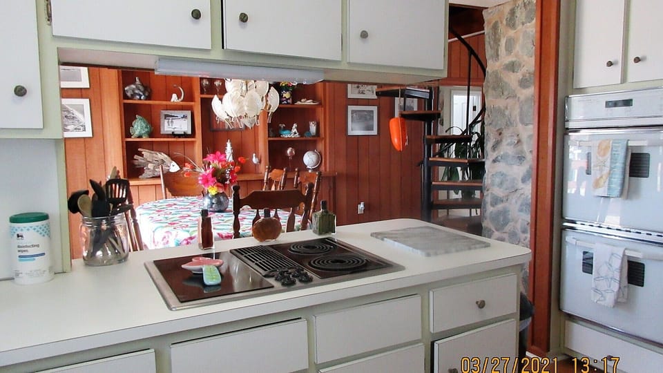 Kitchen w/ adjoining dining room. 