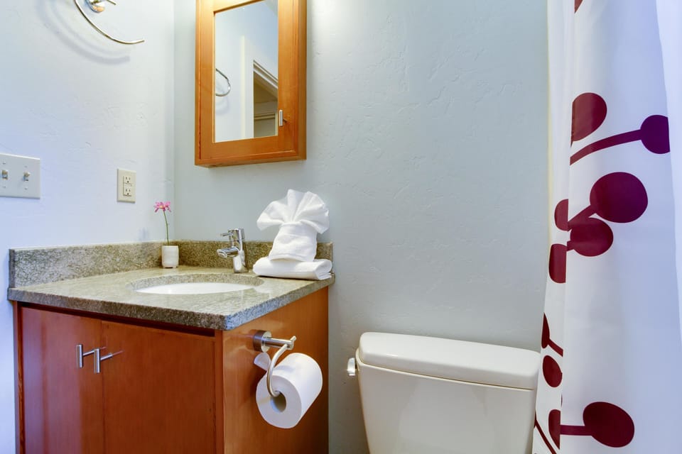 Sweet and simple bathroom, more storage for your toiletry items behind the door.