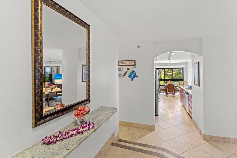 Entry with view of kitchen and dining table