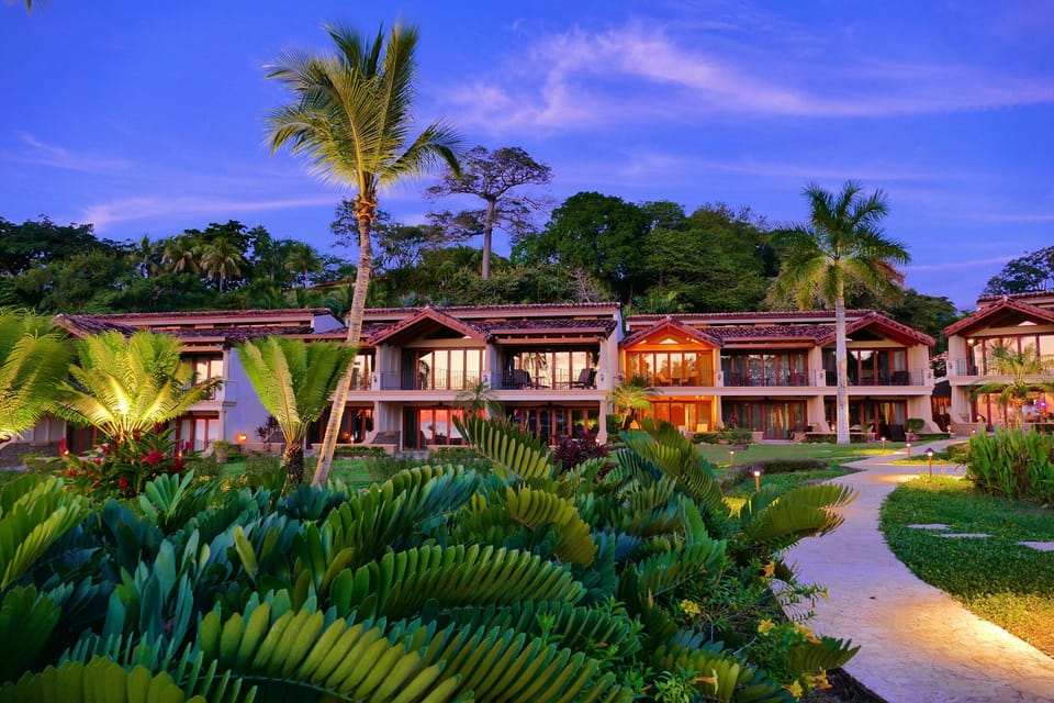 Casa Chocolate all lit up as seen from The Palms' lush gardens.