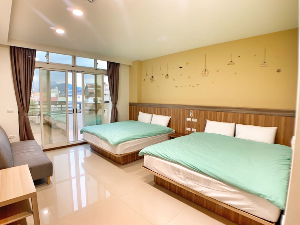 Deluxe Quadruple Room | Hypo-allergenic bedding, blackout drapes, soundproofing, free WiFi