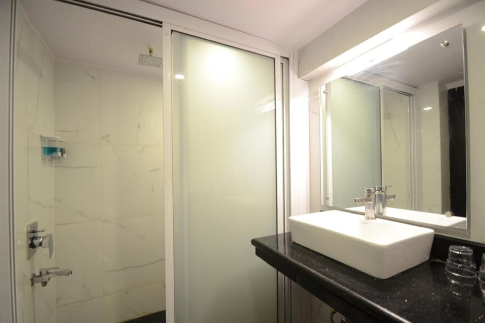 Shower, rainfall showerhead, bathrobes, towels