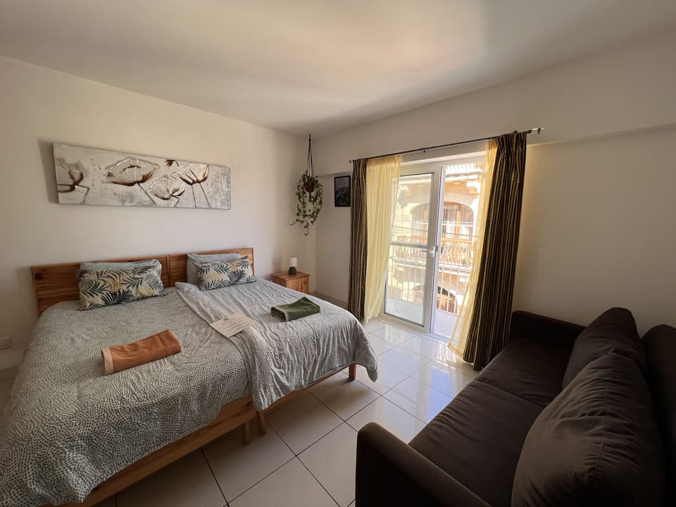Family Triple Room, Balcony, City View | Individually decorated, individually furnished, iron/ironing board