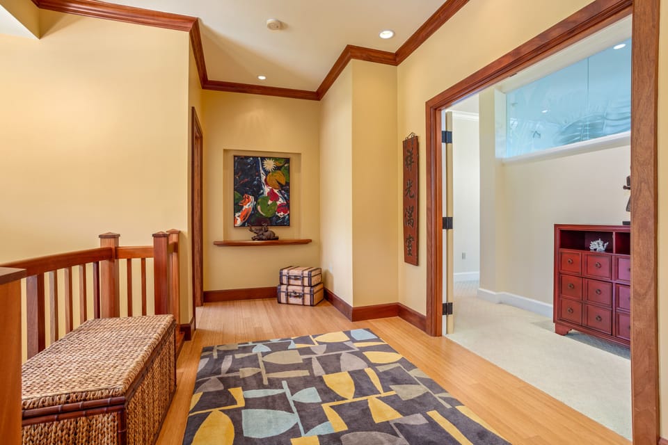 Overlook the open living area below from this spacious and warmly decorated upstairs landing.