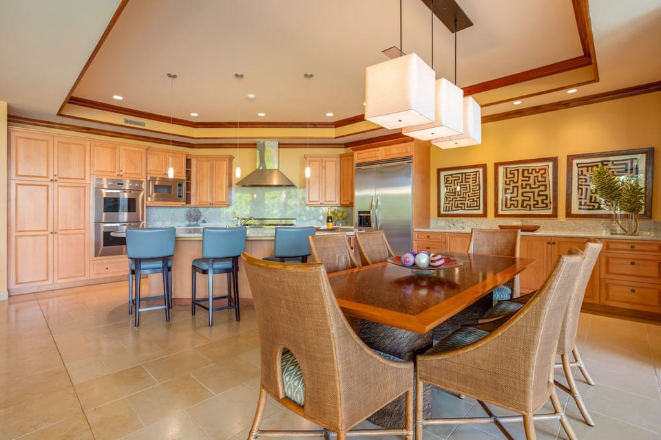 Prepare meals with premium Viking appliances and granite countertops while staying connected with guests at the dining table.