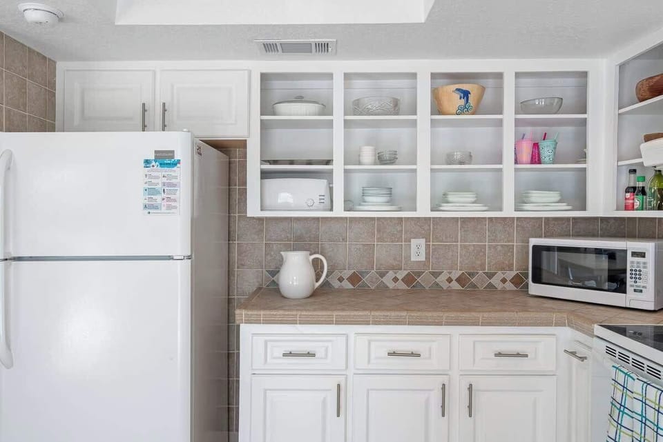 Kitchen with fridge and microwave
